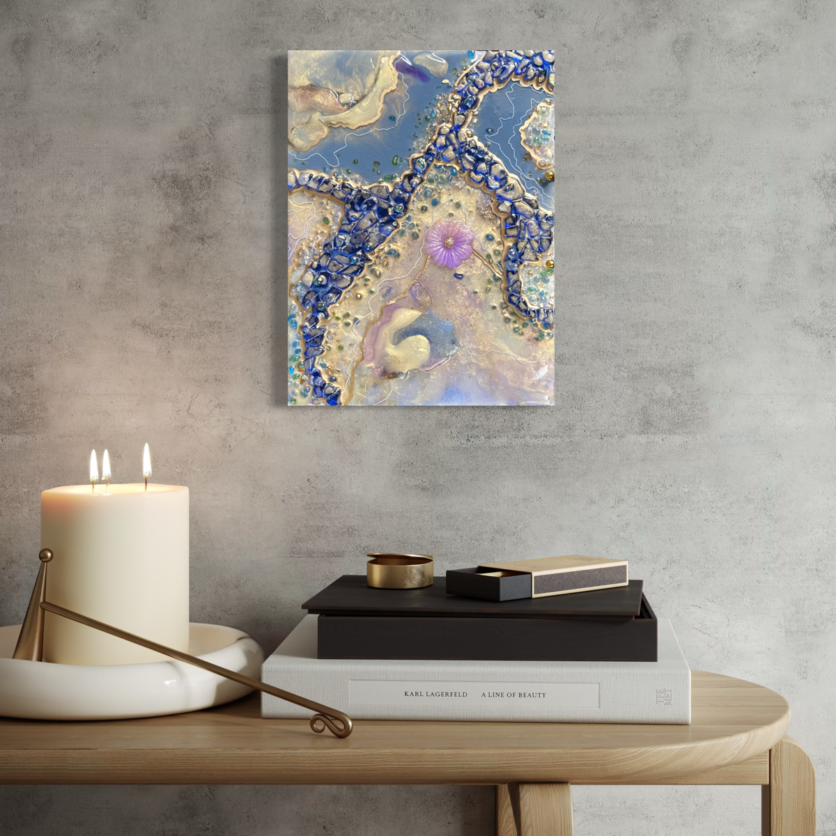 Epoxy resin geode abstract of pearl and blue colors with a purple flower in center hanging on soft grey wall