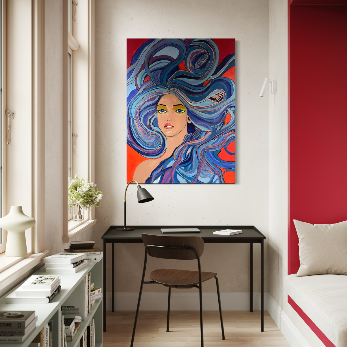 Painting of a girl with blue hair on a orange background hanging on a white brick wall hanging on a wall in a room with a desk and a bed and a red wall