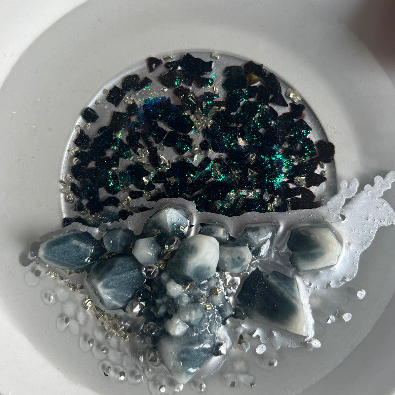 Grey Resin Crystal Cluster sitting on Black Crushed Glass zoom view
