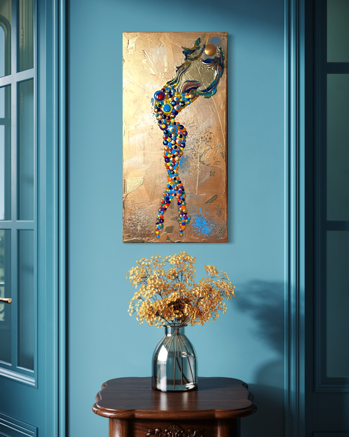 gold abstract of a girl made of circles holding up the sun over a gold background hanging on a blue wall