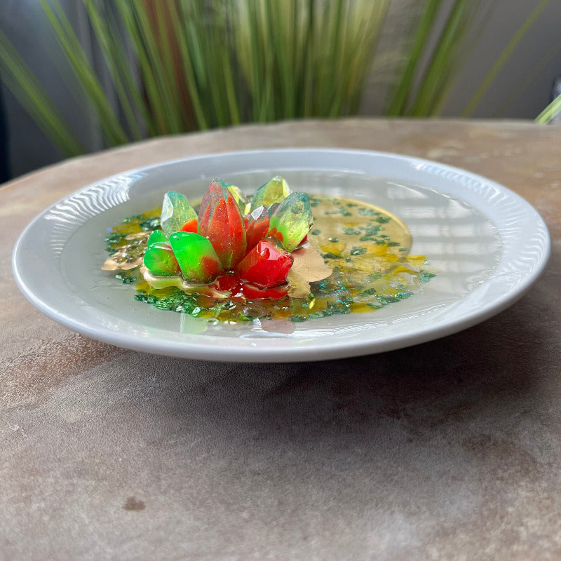 Orange and Green Resin Crystal on Dark green crushed glass side view